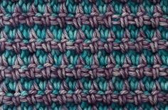 crochet stitchs in shades of purple and teal, closeup photo