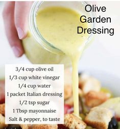 the ingredients for olive garden dressing in a white bowl with a hand drizzled over them