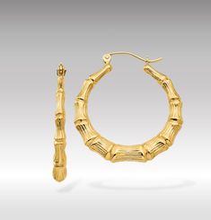 Introducing our 14K Gold Polished Bamboo Hoop Earrings, a chic and nature-inspired addition to your jewelry collection that embodies the beauty of the tropics. These earrings feature a unique bamboo design, offering a fresh and stylish take on the classic hoop earring, crafted in lustrous 14K gold with a polished finish that enhances their allure. The bamboo motif adds an element of tropical elegance, making these earrings a perfect choice for those who appreciate botanical themes or want to infuse a bit of nature-inspired sophistication into their look. Whether you're dressing up for a special occasion or accenting your everyday style, these bamboo hoop earrings provide a versatile and eye-catching accessory. Not only do these earrings celebrate the natural world's beauty, but they also a Nature Inspired Accessories, Bamboo Hoop Earrings, Bamboo Design, Nature Inspired Jewelry, Gold Polish, Jewelry Earrings Hoops, Fantastic Gifts, Gold Material, Nature Inspired