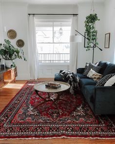 a living room filled with furniture and a rug