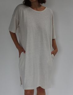 The Lenny Hemp Jersey Midi Dress offers a blend of hemp and organic cotton, creating a distinctive texture that evokes a feeling of nostalgia. Drawing inspiration from the iconic Lenny Tee, this dress seamlessly merges vintage charm with contemporary practicality for year-round wear. It features a soft scoop neckline, dropped shoulders, spacious side pockets, side slits for easy mobility, and falls gracefully to midi length.Made in USA Summer Linen Sleep Dress, Linen Sleeveless Loungewear Dress, Relaxed Fit V-neck Linen Dress For Beach, Relaxed Fit Linen Beach Dress With V-neck, Relaxed Fit Cotton T-shirt Dress, Knit Outerwear, Line Shopping, Linen Shop, Knit Cotton