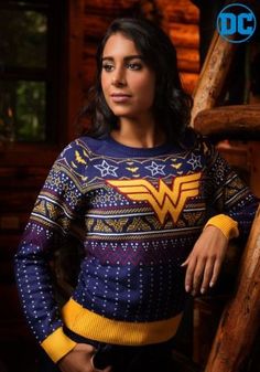 a woman wearing a blue and yellow sweater