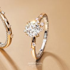 two engagement rings with diamonds on them