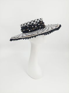 Timeless and classic black and white checkerboard hat. Accented with gold and pearls. Handmade and one of kind. 58cm with adjustable band. Comes with a hat box.