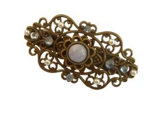 This small hair clip is a beautiful accessory for braids or as jewelry for a festive updo. The hair accessory is made of bronze-colored metal. In the middle there is a flower-shaped jewelry setting with a gemstone cabochon in blue white. The hair clip is also decorated with high-quality rhinestones in blue and white half pearls. The hair clip measures 2.9 L x 5.5 W cm. Antique Clip-on Jewelry For Parties, Formal Gold Clip-on Cabochons, Vintage Evening Clip-on Jewelry, Antique Clip-on Brooches For Gifts, Vintage Blue Clip-on Jewelry, Small Hair Clips, Wedding Updo, Handmade Gift Wrap, Bridal Hair Pieces