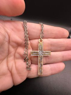 Very lightweight metal. Great cross!  Simple and elegant.  Minor wear on finish. Gold Metal Crucifix Cross Necklace, Elegant Metal Crucifix Cross Necklace, Spiritual Cross Jewelry In Metal, Spiritual Metal Cross Necklace, Metal Cross Pendant Necklace, Vintage Cross Shaped Metal Jewelry, Vintage Cross-shaped Metal Jewelry, Vintage Metal Crucifix Cross Necklace, Nickel-free Gold Cross Necklace