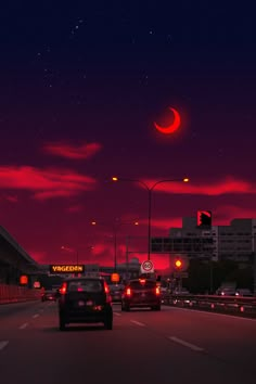 cars driving down the road at night with red sky and moon behind them in the distance