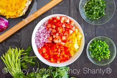 chopped vegetables are in bowls next to chopsticks on a table with other ingredients