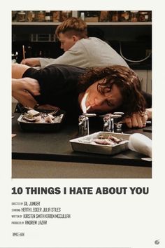 a man laying on top of a counter next to food