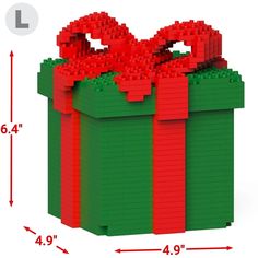 a large lego christmas present box with red bows on it's top and bottom