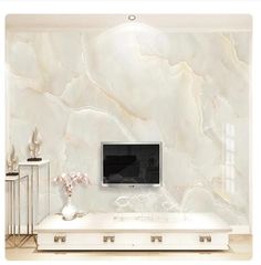 a living room with marble walls and white furniture