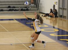 a volleyball player in action on the court