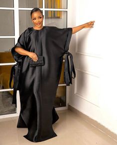 Beautiful black silk dress.Perfect attire for that simple and classy look, suitable for evening wear, beach wear, summer dress etc. Kindly attach the following measurements when ordering for a perfect fit . Available in other colors too. Bust Waist Hips Dress Length Shoulder Thank you for shopping💖. Luxury Black Silk Kaftan, Luxury Elegant Dola Silk Gown, Luxury Black Kaftan For Evening, Luxury Elegant Dola Silk Dresses, Luxury Black Kaftan For Party, Gomesi Dress, Mikado Silk, Boubou Dress, Boubou Styles For Women