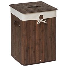 a brown and white wooden box with a bow on the top, sitting against a white background