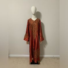 Nwot True To Color! Has Orange, Beige, And Bronze Embroidered Design Throughout The Dress And Sleeve Area! This Is Made In Saudi Arabia And Is A True To Size Xl. Dimensions Listed Below. It Is Very Cute For Ramadan Outings As Well! I Have A Small Middle Eastern Traditional Clothes And Souvenirs Business. If You May Be Interested Search Middle East” In My Closet To Locate Them! Dimensions: 24.5 Inches Armpit To Armpit 22.5 Inches Sleeve Length 9 Inches Sleeve Width 53 Inches Overall Length Silk Anarkali Long Sleeve Kaftan, Silk Anarkali Kaftan With Long Sleeves, Anarkali Silk Kaftan With Long Sleeves, Embroidered Silk Maxi Length Kaftan, Long Sleeve Embroidered Agbada For Festive Occasions, Long Sleeve Embroidered Agbada For Festivals, Festive Embroidered V-neck Thobe, Festive V-neck Embroidered Abaya, Elegant Orange Traditional Drape Dress