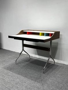 a desk with four colored sections on it