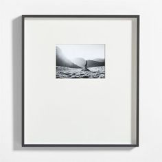 a black and white photo hanging on the wall