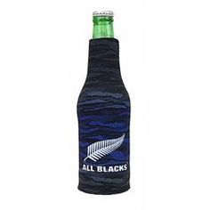 an all blacks beer bottle with a leaf on the top and blue wrapper around it