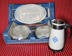 a white and blue tableware set in a box on a red polka dot cloth