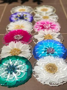 colorful flower brooches laid out on the ground