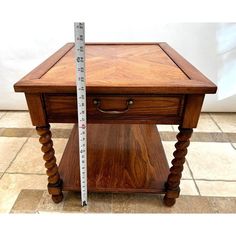 a wooden table with a measuring tape on it