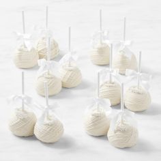 white chocolate covered candies tied with ribbons