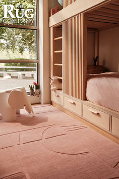 an elephant rug is in the middle of a room with bunk beds and shelves on both sides