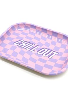 a pink and purple checkered tray with the word chill out on it's side