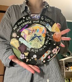 a person holding a plate with words on it