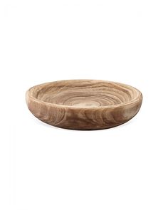 a wooden bowl sitting on top of a white surface