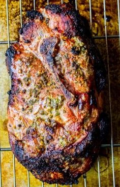 a piece of meat sitting on top of a metal rack