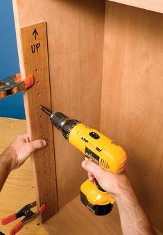 Tips for Installing Shelf Supports by Seth Keller Drilling shelf-support holes is not difficult, but you only get one chance to get it right. If you make a mistake, you’ll get holes that don’t line up and shelves that rock or are way out of level. Here are some tips to remove the guesswork from drilling the shelf-support holes and to improve your accuracy. I’ve also included some tips on … Cabinet Shelves, Shelf Support, Astuces Diy, Woodworking For Kids, Woodworking Magazine, Diy Holz, Shelf Supports, Popular Woodworking