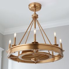 a chandelier hanging from the ceiling in a room with white walls and flooring