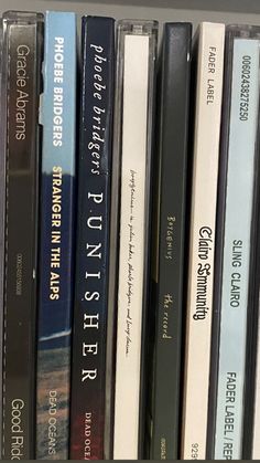 a row of books sitting on top of a shelf