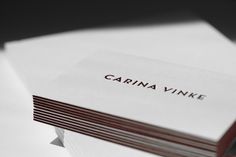 a stack of white cards with the word carina vinke on it's front