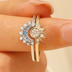 ✨ Embrace the celestial allure with our Celestial Sun Moon Ring Set! 🌞🌙 Let the enchanting quote "Live by the sun, love by the moon" guide your journey. Crafted with love, this set is made of 925 Sterling Silver, adorned with sparkling crystals, and plated with White Gold. 💖 ✨ Rest assured, this ring is Nickel-free, Lead-free, Cadmium-free, and Hypoallergenic, ensuring a safe and comfortable wearing experience for all. 💫 Quality Assurance guarantees its skin-friendly nature, making it a perf Adjustable Celestial Crystal Ring With Moon Phase, Adjustable Sun And Moon Design Jewelry For Promise Ring, Celestial Moon Phase Crystal Ring, Adjustable Magical Jewelry With Sun And Moon Design, Adjustable Ring With Sun And Moon Design, Adjustable Magical Sun And Moon Jewelry, Adjustable Sun And Moon Design Rings, Adjustable Celestial Jewelry With Sun Design, Adjustable Celestial Sun Design Jewelry