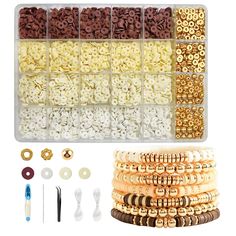 the beading kit is organized with beads, buttons and other accessories for making bracelets