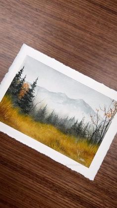 an image of a painting on a piece of paper that is sitting on a table