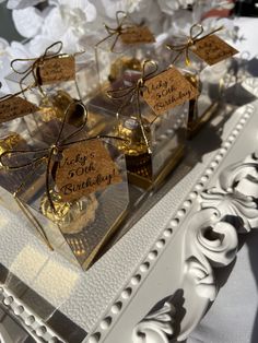 small clear boxes filled with cookies on top of a table