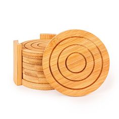 wooden coasters stacked on top of each other with one in the middle and another in the back