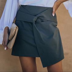 Brand New, Olive-Grey Cotton, With A Non-Stretch/True To Size Silhouette. Detailed With A Front Knot That Connects An Overlapping Front With An Asymmetrical Hemline. Chic Solid Color Skort For Spring, Elegant Asymmetrical Skort For Spring, Spring Asymmetrical Mini Skirt For Workwear, Asymmetrical Mini Skirt For Spring Workwear, Chic Asymmetrical Hem Mini Skirt For Work, Trendy Gray Mini Skirt For Spring, Trendy Gray Skort For Spring, Casual Gray Skirt For Office, Spring High Waist Gray Mini Skirt