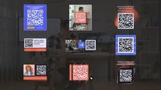 a person sitting at a table with some qr code on it