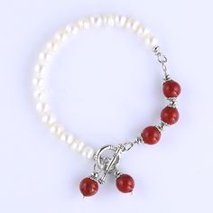 Cultured Freshwater Pearl And Semi Precious Stone Toggle Bracelet Real Freshwater Pearl And Semi Precious Stones: 8mm Red Jasper, Fresh Water Pearl Beads Bracelet Length: Approximate 7inch/18cm. Retails For $225.00 Material: Silver Plated Clasp Type: Toggle Elegant Red Pearl Bracelets, Red Pearl Bracelet Gift, Elegant Red Beaded Bracelets With Lobster Clasp, Red Pearl Bracelet As Gift, Red Pearl Bracelets For Gifts, Red Pearl Bracelet As A Gift, Red Pearl Bracelets For Gift, Red Pearl Bracelets As A Gift, Red Jasper Bracelet