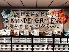 an assortment of teddy bears and other items on display in a store with the words kindergaten us & couty