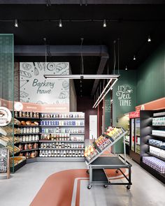 an empty grocery store filled with lots of food and drink bottles in it's display cases