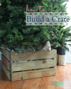 a christmas tree in a wooden crate with the words how to build a crate on it