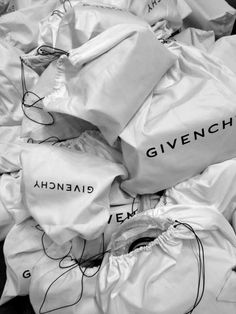 a pile of white bags sitting on top of each other