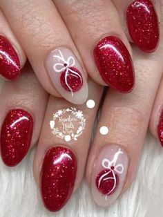 red and white manies with bows on the tips, one nail has been painted