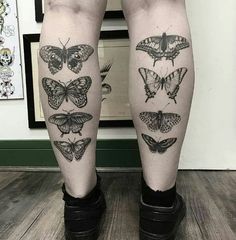 a woman's legs with butterfly tattoos on their thighs, both in black and white