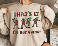 That's It I'm Not Going Sweatshirt, Ooh Aah Grench Christmas T-shirt, Funny Grinchmas Crewneck Shirts, Christmas Gift for Christmas Squad - Soft unisex sweatshirt - High quality design printing -50% cotton, 50% polyester -No itchy side seams! -Sewn in label -Loose Fit -Runs True to size Please note: any styles you see in the main photo such as sleeves rolled up or a knot tied, are just style suggestions and not how the shirt comes. The shirts are a unisex shirt as shown in the color chart.  Note Xmas Tees, Christmas Crewneck, Mugs Stickers, Just Style, Gift Cute, Funny Sweatshirts, Christmas T Shirt, Crew Neck Shirt, Cut Shirts